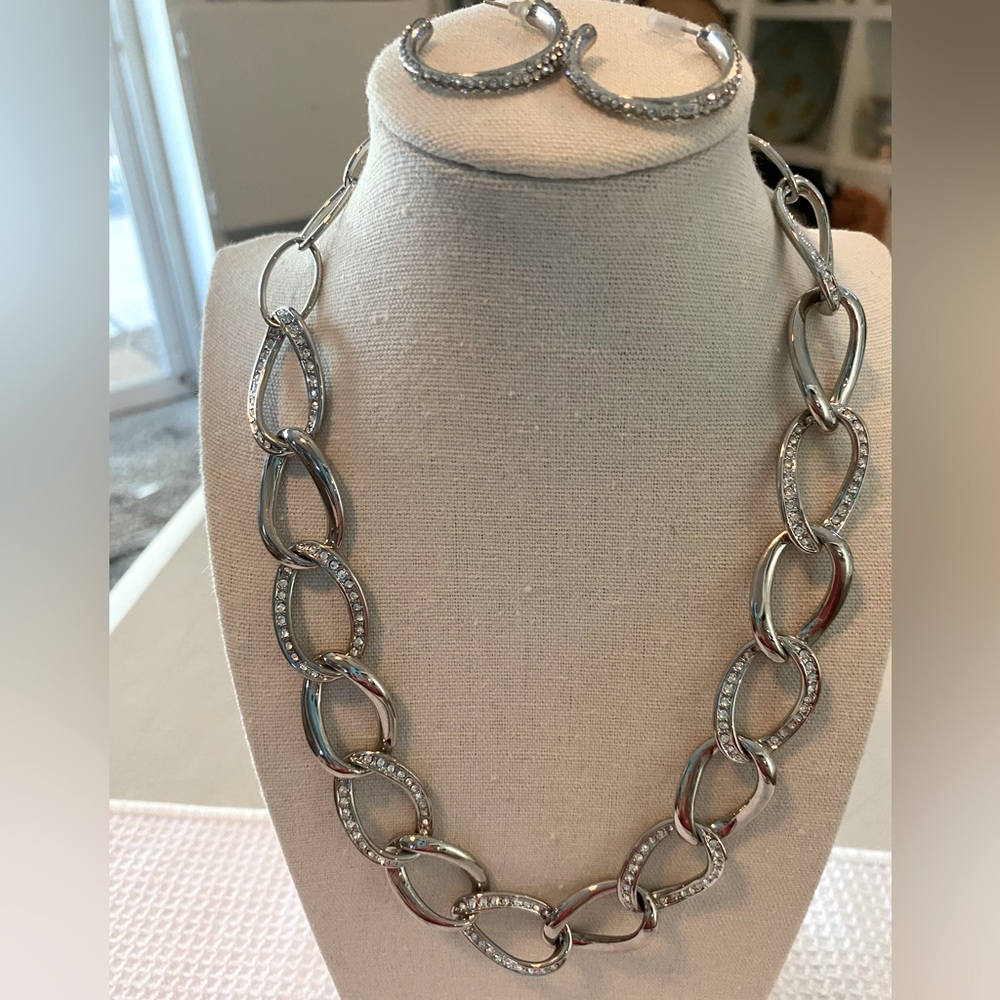 Chico’s silver and reinstones necklace w/earings. See pictures for details.2 pc.